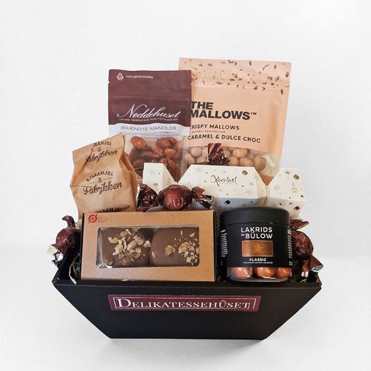 Julekurv med forskellige søde julelækkerier. En perfekt julehilsen